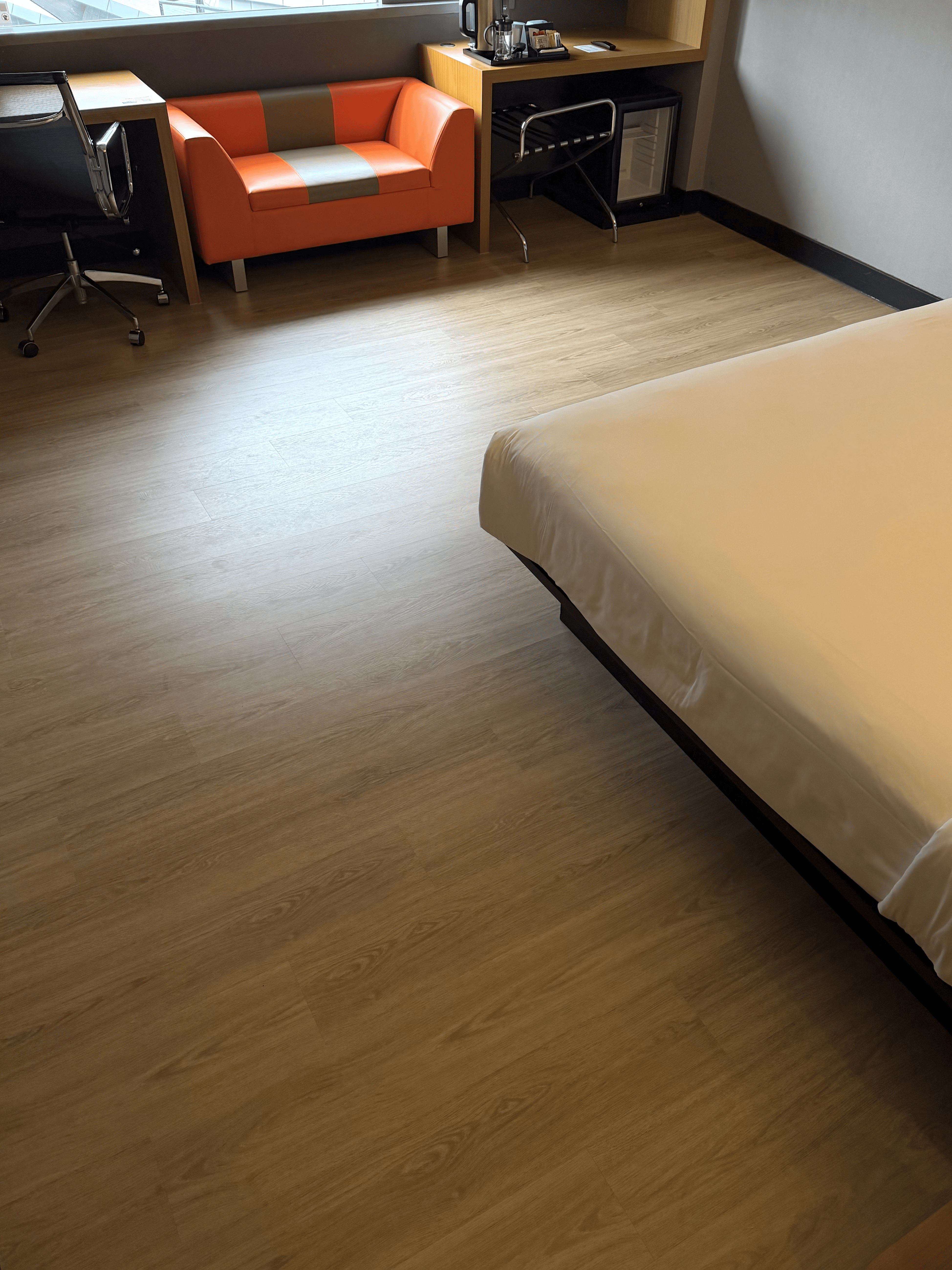 Completed commercial room with SPC flooring by Weehome