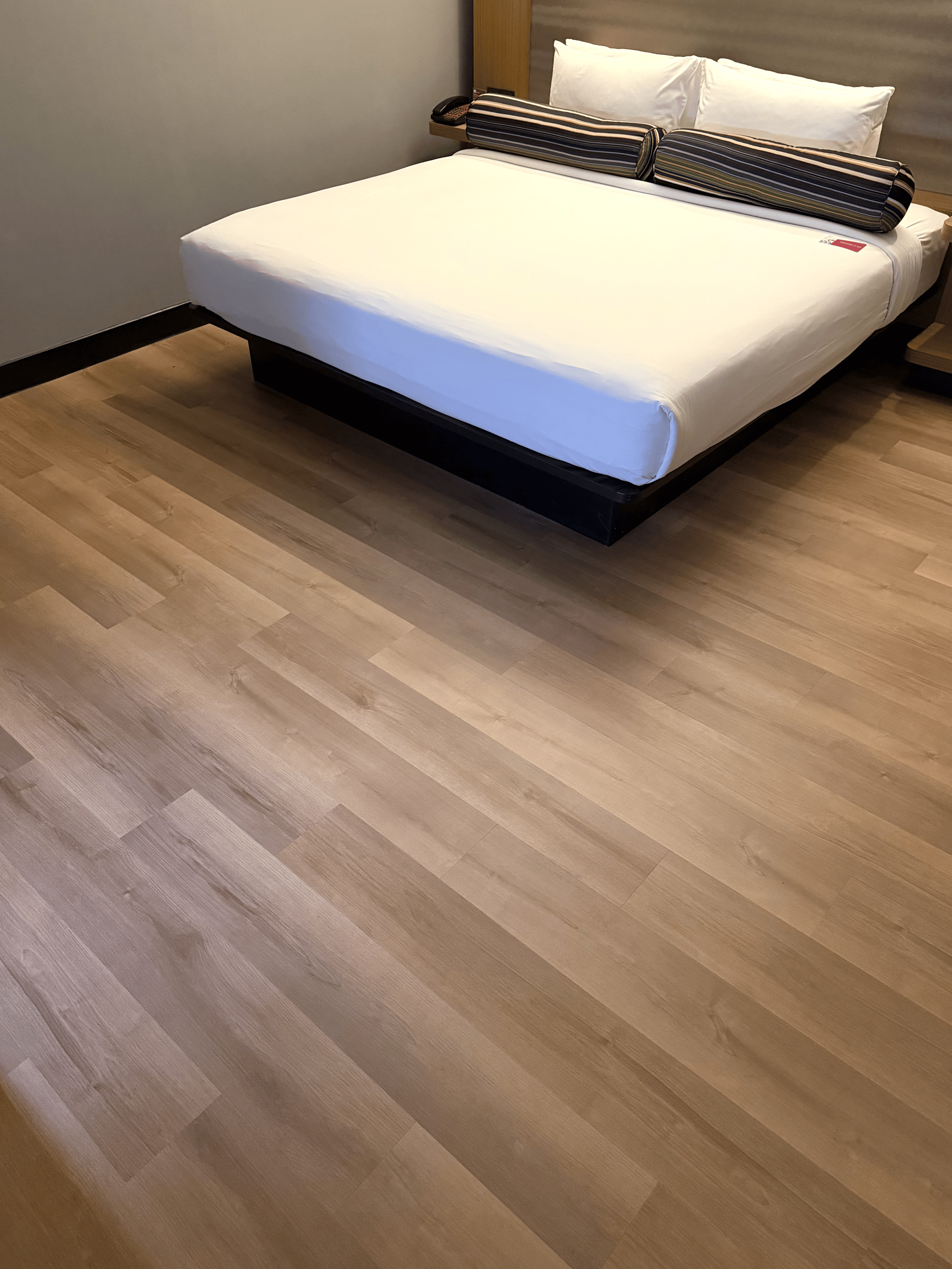 Completed commercial room with SPC flooring by Weehome